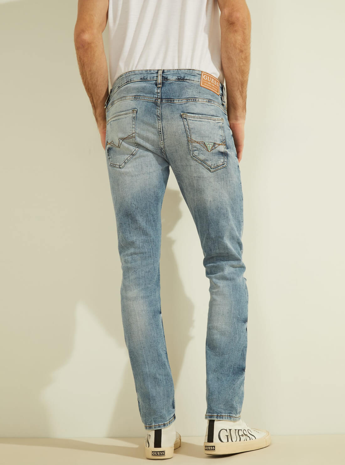 GUESS Mens Eco Low-Rise Skinny Fit Miami Denim Jeans in Badwater Blue Wash M1GAN1D4B13 Model Back View