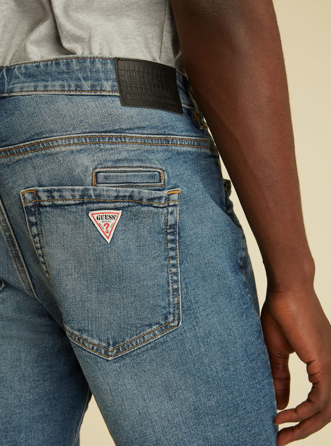 GUESS Mens GUESS Originals Mid-Rise Slim Straight Denim Jeans In Stone Wash M1GA05R49T0 Model Back Detail View