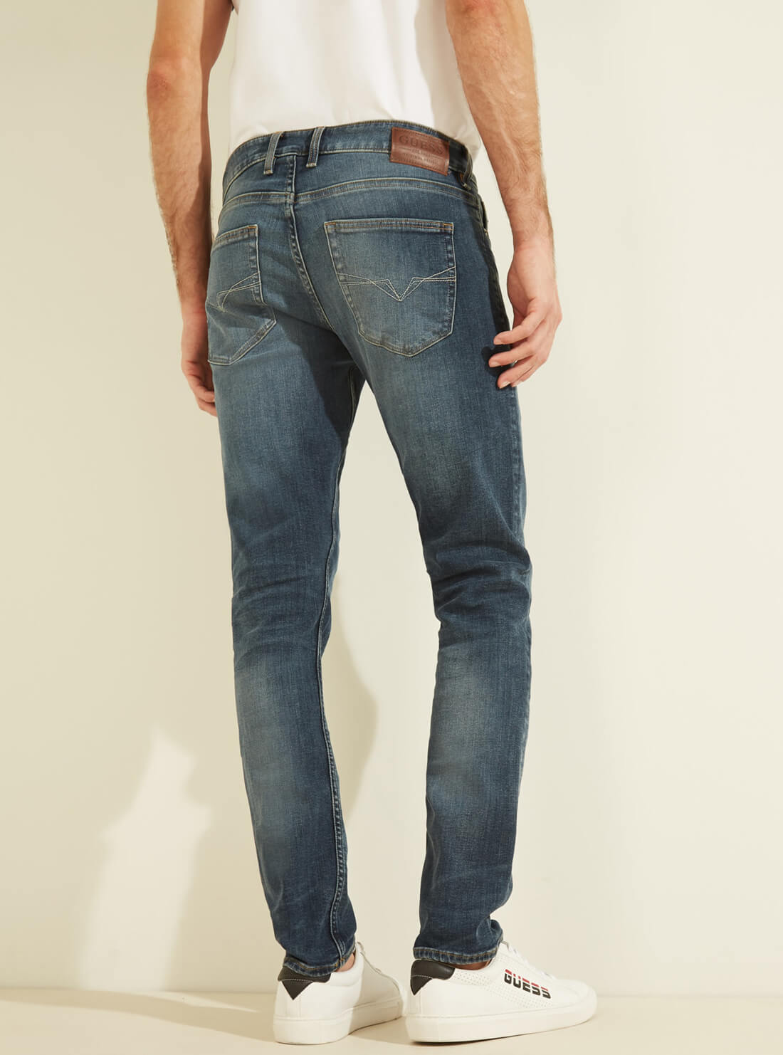 GUESS Mens Mid-Rise Slim Tapered Denim Jeans in Classic Wash MBYAS2R44D0 Back View