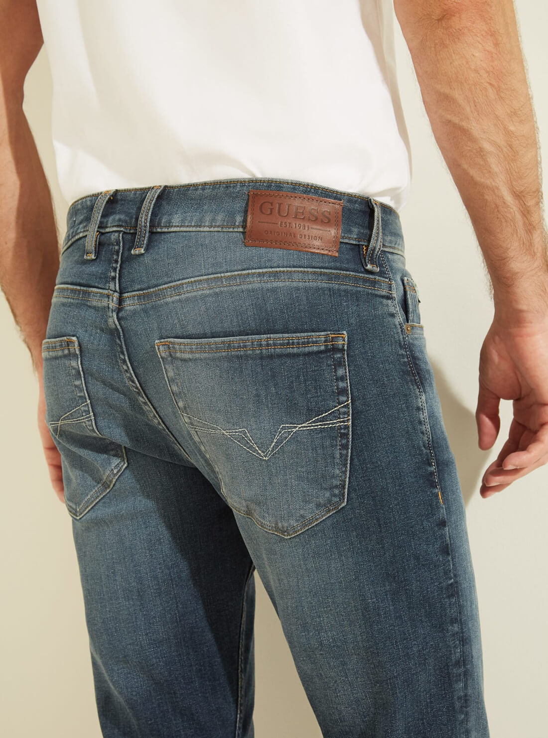 GUESS Mens Mid-Rise Slim Tapered Denim Jeans in Classic Wash MBYAS2R44D0 Back Detail View