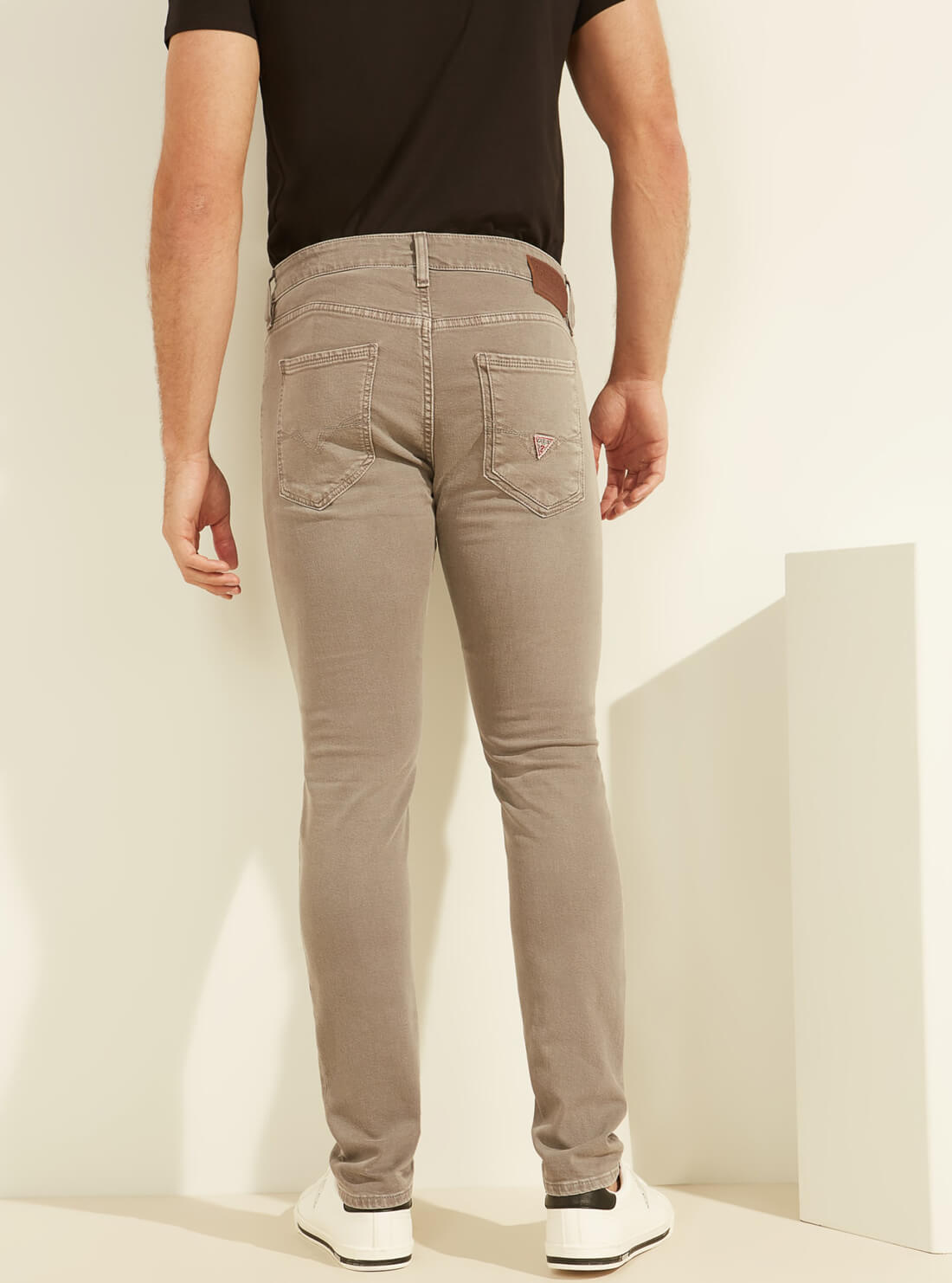 GUESS Mens Low-Rise Dyed Skinny Denim Jeans in Light Brown Khaki M1YAN3R34V0 Back View