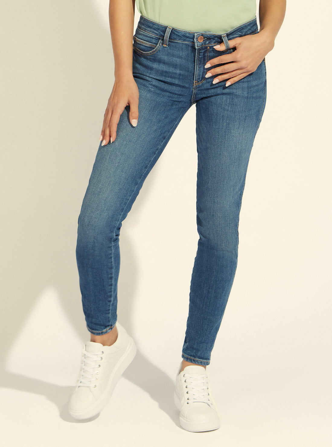 GUESS Womens Mid-Rise Skinny Curve Denim Jeans in Carry Mid Wash W1YAJ2D4GV2 Model  Front View
